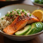 Finished Salmon Rice Bowl with fresh ingredients and garnishes.