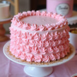 Finished Barbie cake with pink ruffles and glitter, perfect for a Barbie-themed party.