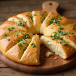 Finished Cunetto's Garlic Cheese Bread with parsley, ready to serve.