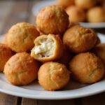 Finished Rotel cream cheese sausage balls on platter.