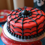 Finished Spider-Man cake with web design, perfect for a superhero-themed birthday.
