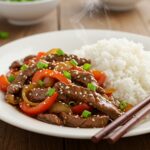 Delicious presentation of Easy Chinese Pepper Steak served with rice, perfect for an inviting meal setting.