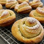 Delicious Cruffins finished and ready to serve, highlighting their flaky texture and sweet flavors.