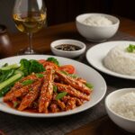 Delicious spicy dragon chicken served with jasmine rice and vegetables, an inviting Asian meal you'll crave.
