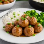 Delicious honey garlic turkey meatballs served with vegetables and rice, a perfect dish for a family dinner with blend of sweet and savory flavors.